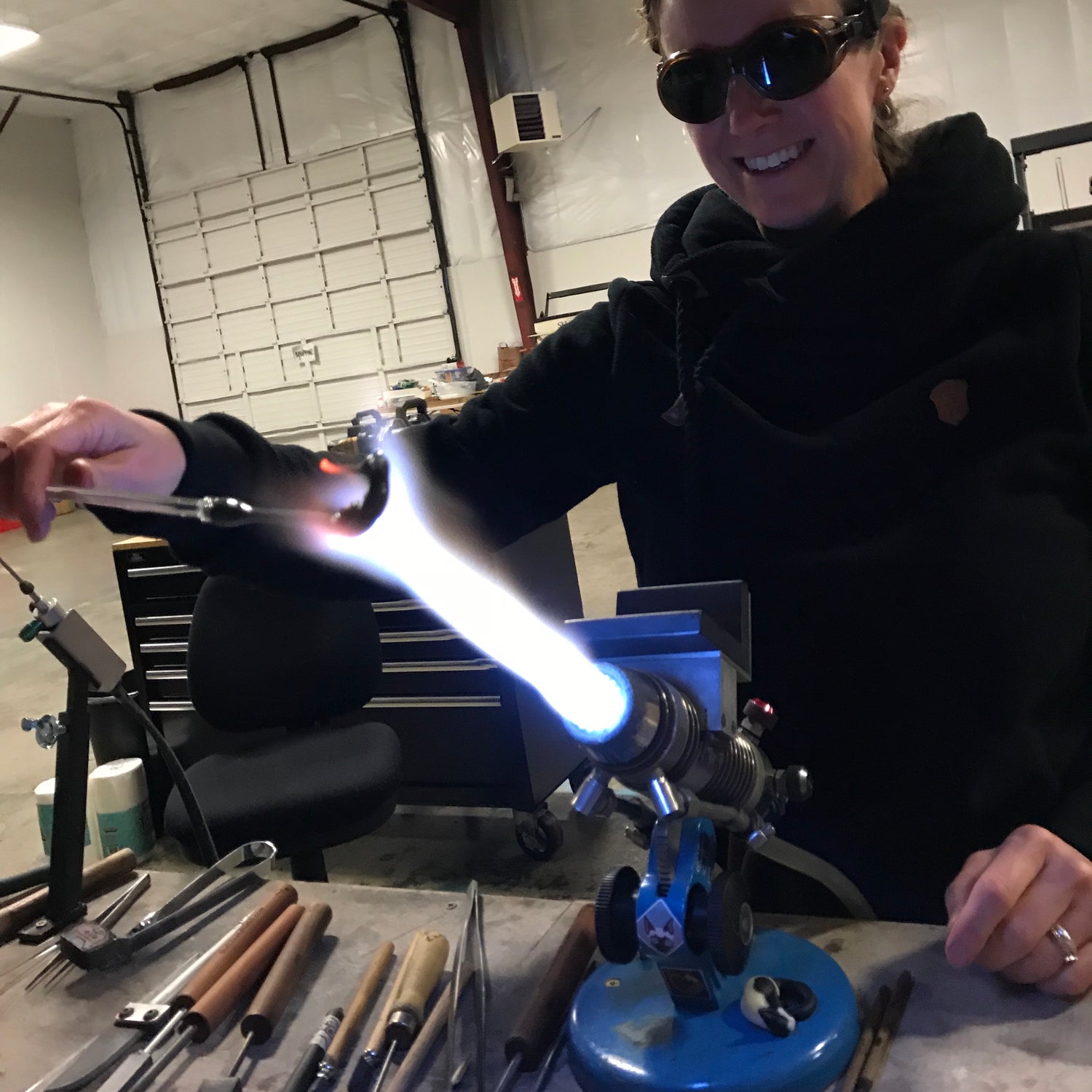 Annie blowing glass in her glass studio on a Bethlehem PM2D torch