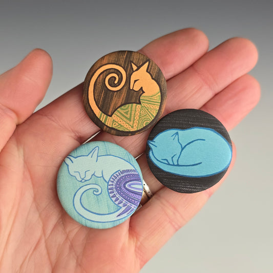 Soft matte textured buttons with images of colorful cat paintings by Annie Woods