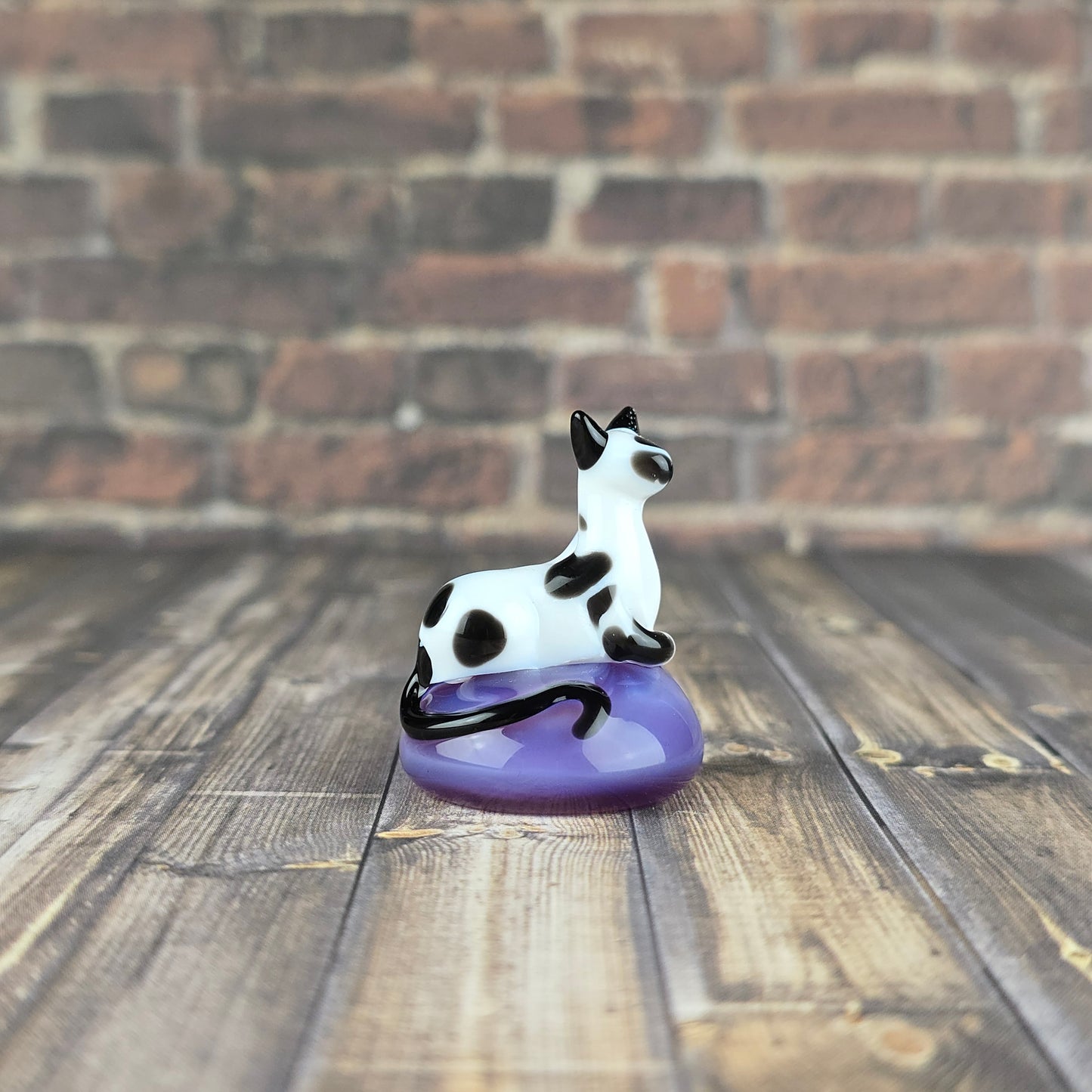 Memorial Loafing Cow Kitty sculpture made of glass