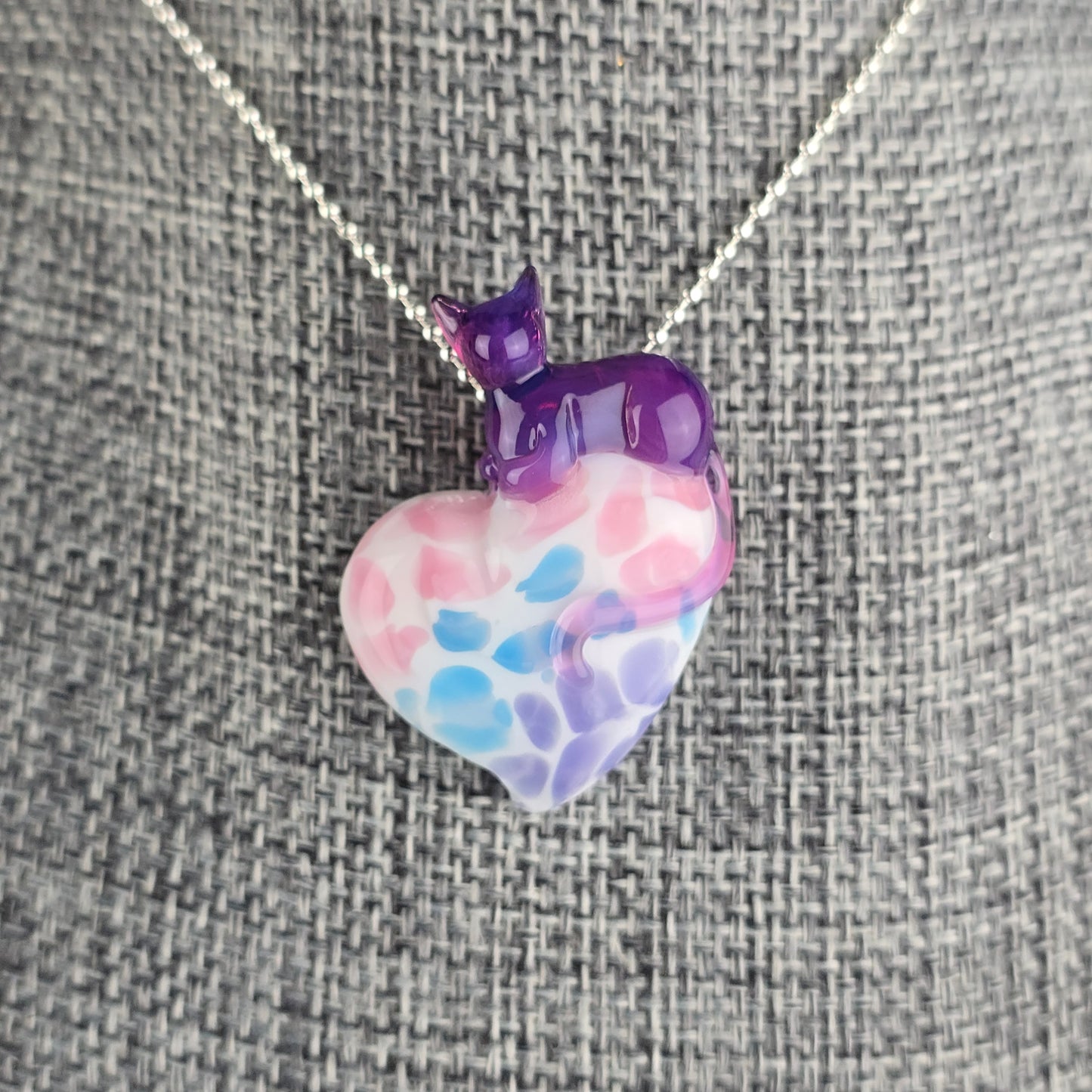 Royal Jelly by Molten Aura glass cat loafing on a pastel bengal patterned heart