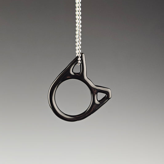 Black handmade glass cat necklace with one ear tipped representing TNR trap neuter return