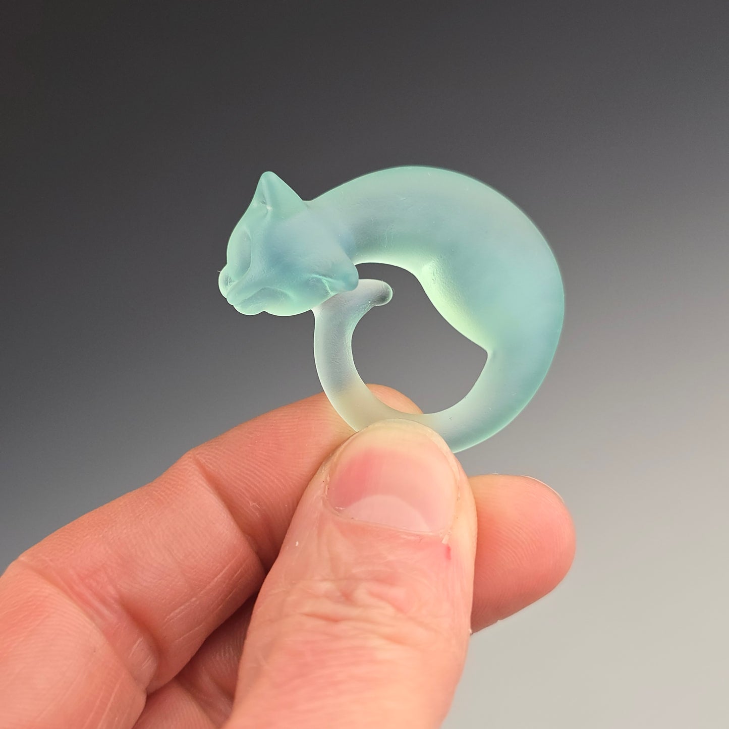 sleeping kitty necklace sandblasted to have a beach glass appearance