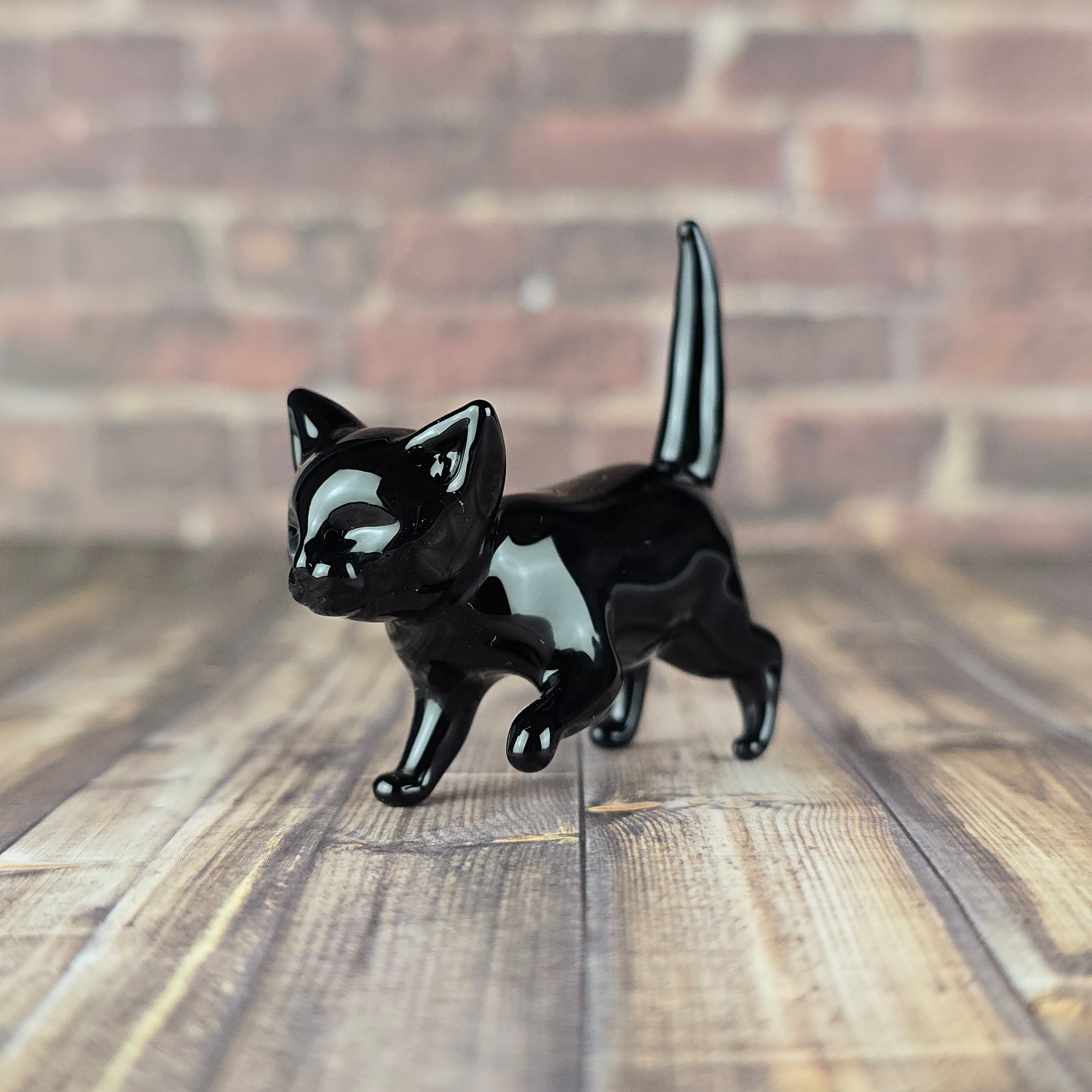 small glass sculpture of a potato cat