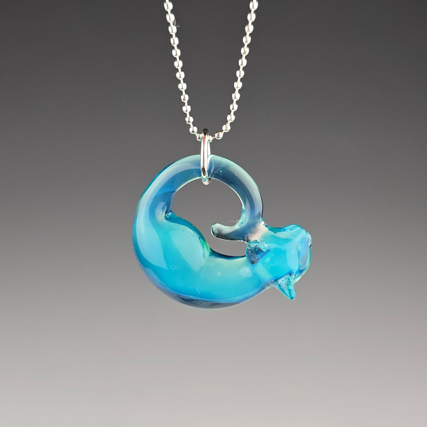 glass sleeping kitty necklace made with molten aura's meta terrania