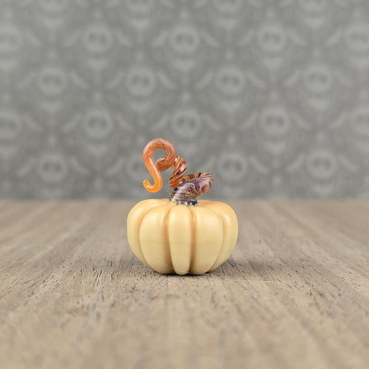 miniature handmade glass pumpkin with twisty dark brown stem