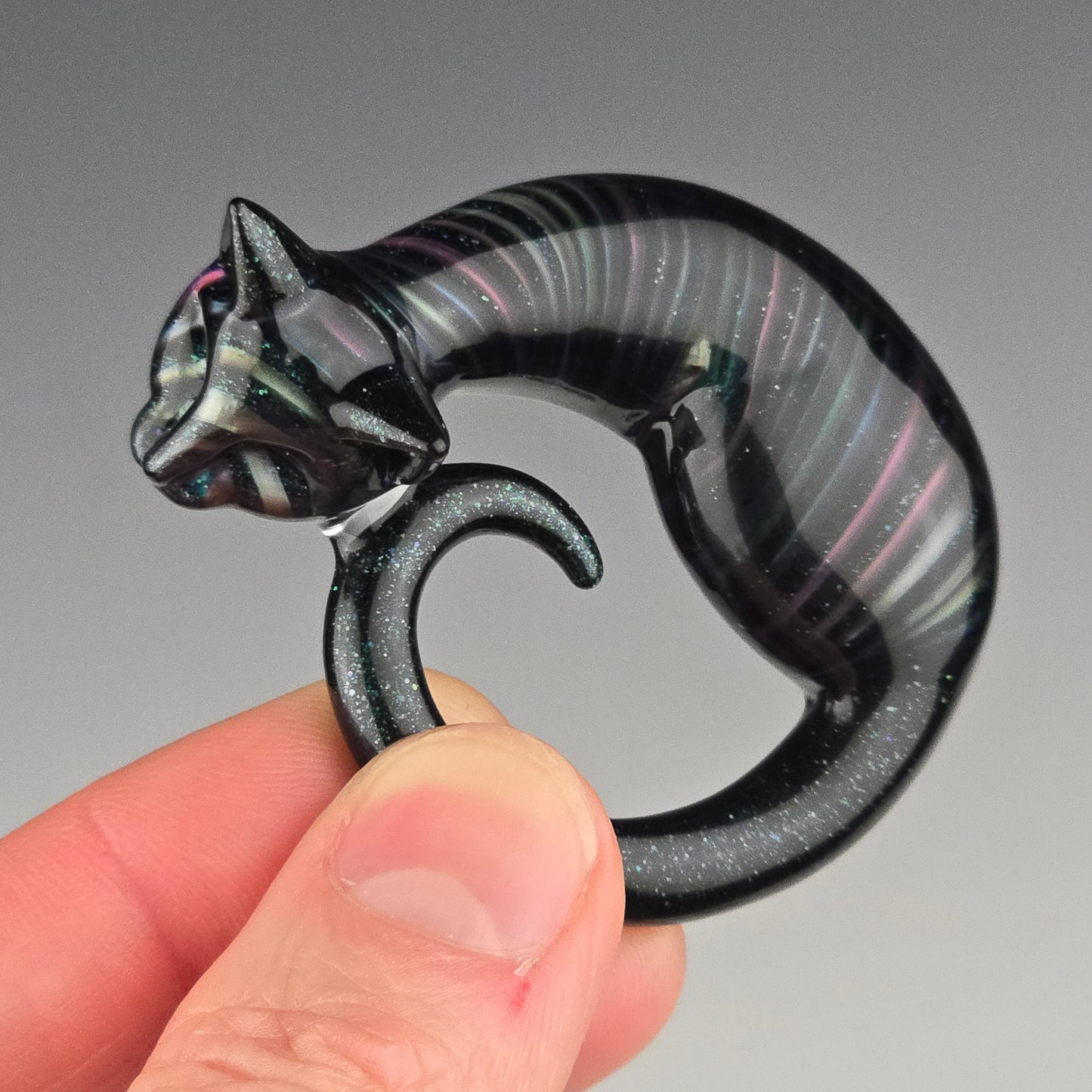 small hand carved glass sleeping kitty sculpture