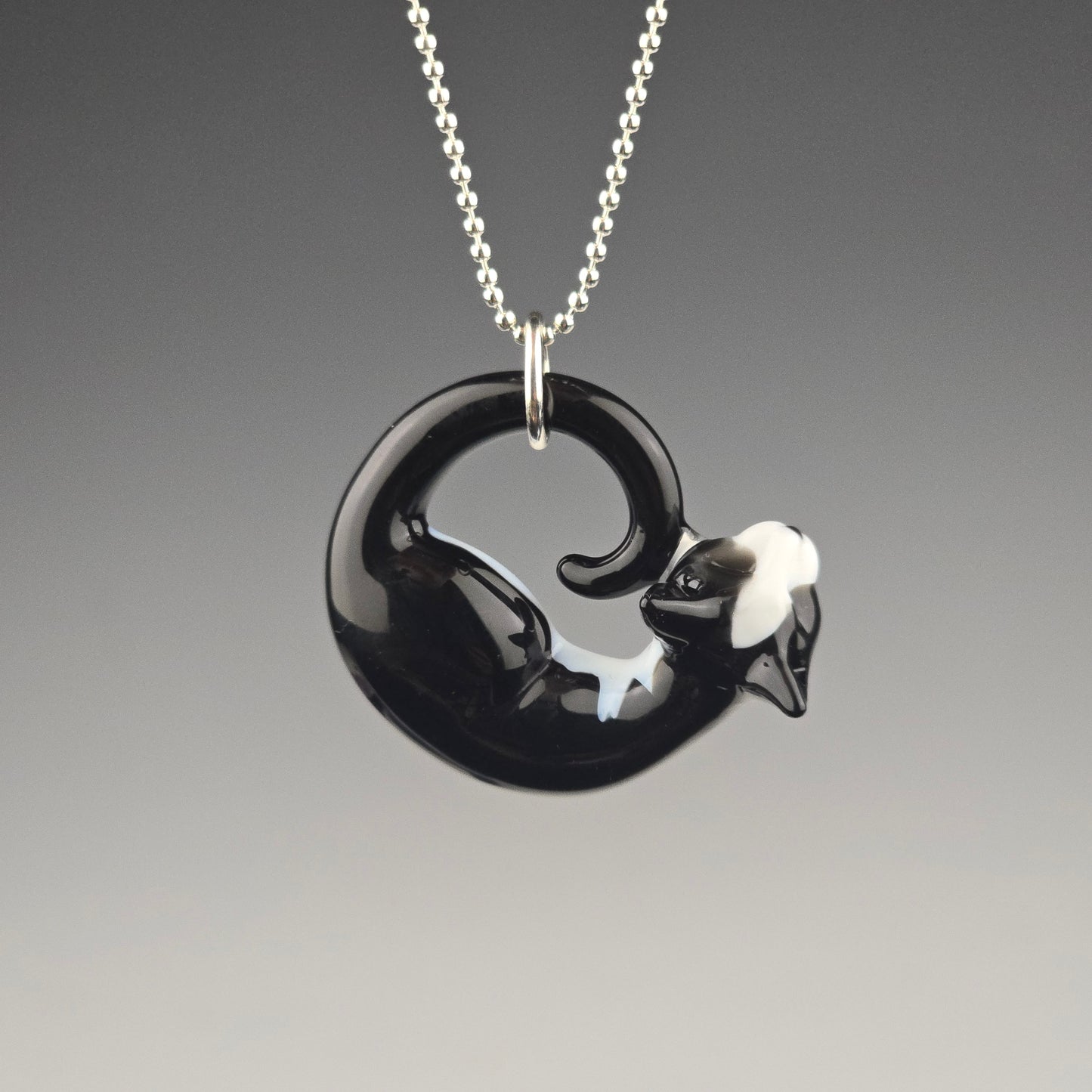 Glass tuxedo cat sleeping kitty pendant